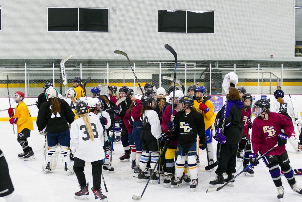 young people learning stickhandling